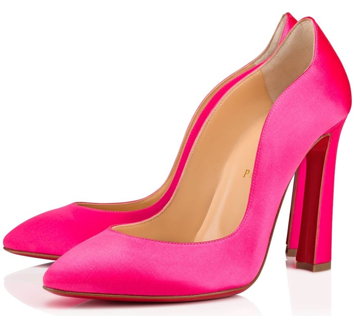 Vivid pink Christian Louboutin Agneska Wave pumps with a curved topline, flared heel, and signature red sole