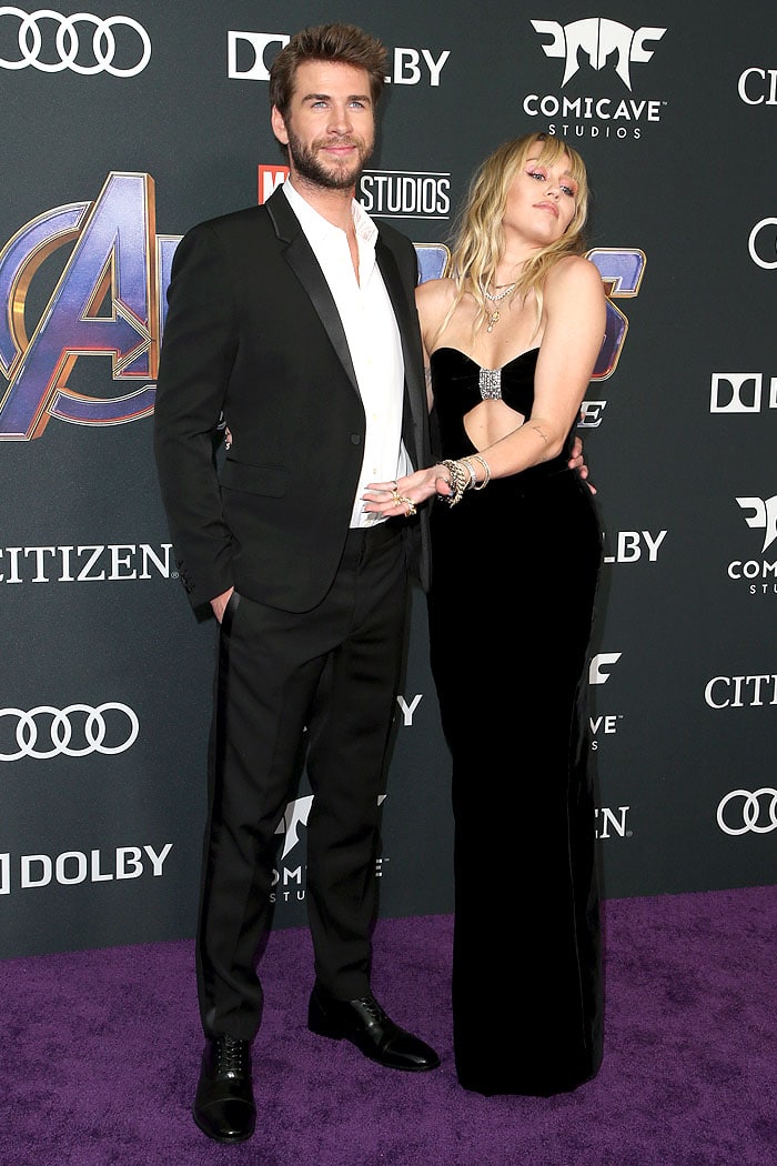 Miley Cyrus turned heads in a strapless black velvet gown with a sparkling crystal embellishment, while Liam Hemsworth looked sharp in a classic black suit at the Avengers: Endgame premiere held at the Los Angeles Convention Center
