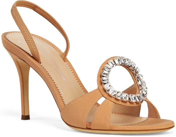 Giuseppe Zanotti’s Adele sandals feature a satin finish and a circular crystal buckle that adds just enough sparkle to complement couture eveningwear