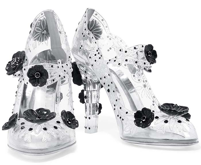 Dolce Gabbana “Bette” Cinderella Mary Jane pumps embellished with black floral appliqués, contrasting the ornate flowers with transparent etched uppers and crystal-clear heels