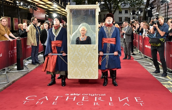 Helen Mirren transformed the Catherine the Great premiere into a regal spectacle, arriving on the red carpet in an ornate gold sedan chair carried by costumed guards