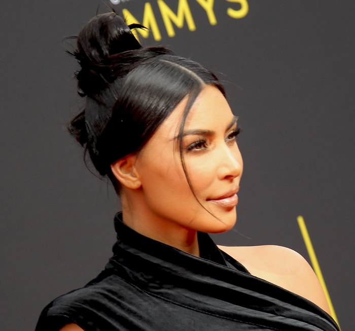 Kim Kardashian wearing her dark hair in a high top knot at the 2019 Creative Arts Emmys