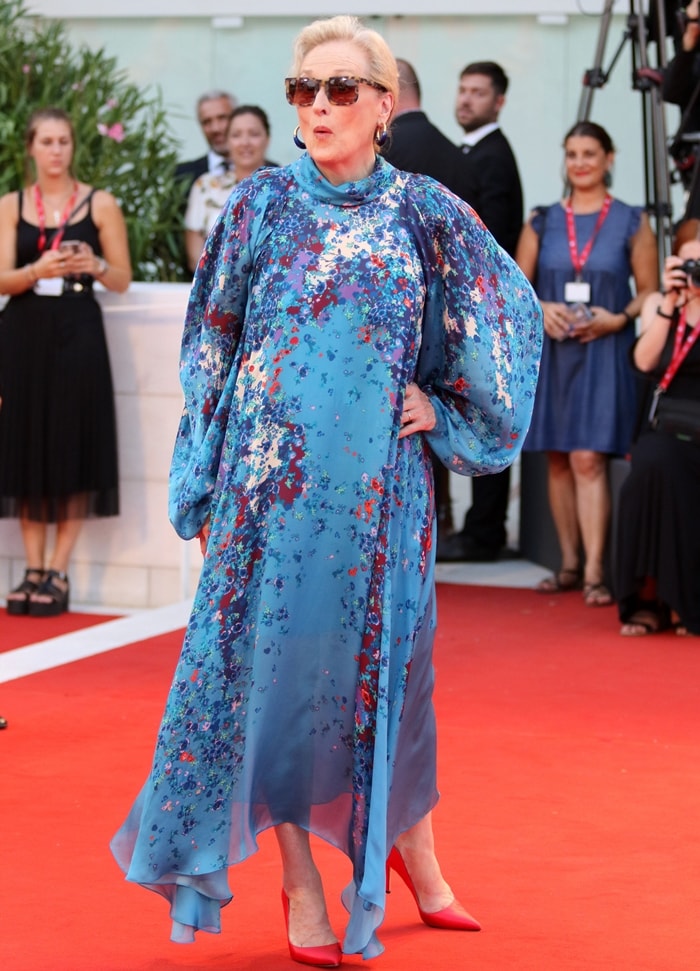 Meryl Streep paired her flowing Givenchy Fall 2019 gown with vibrant ruby-red satin pumps at the premiere of The Laundromat