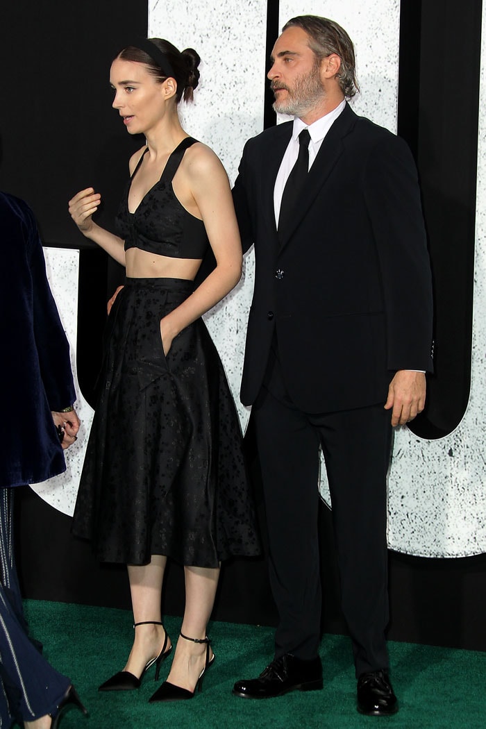 Rooney Mara posing alongside fiancé Joaquin Phoenix on the green carpet at the Joker premiere held at the TCL Chinese Theatre IMAX in Hollywood, California, on September 28, 2019