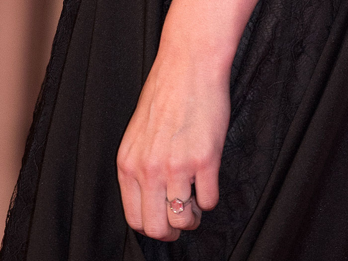 A close-up highlights Rooney Mara’s understated engagement ring, featuring a striking hexagonal-cut diamond set on a slim, minimalist band