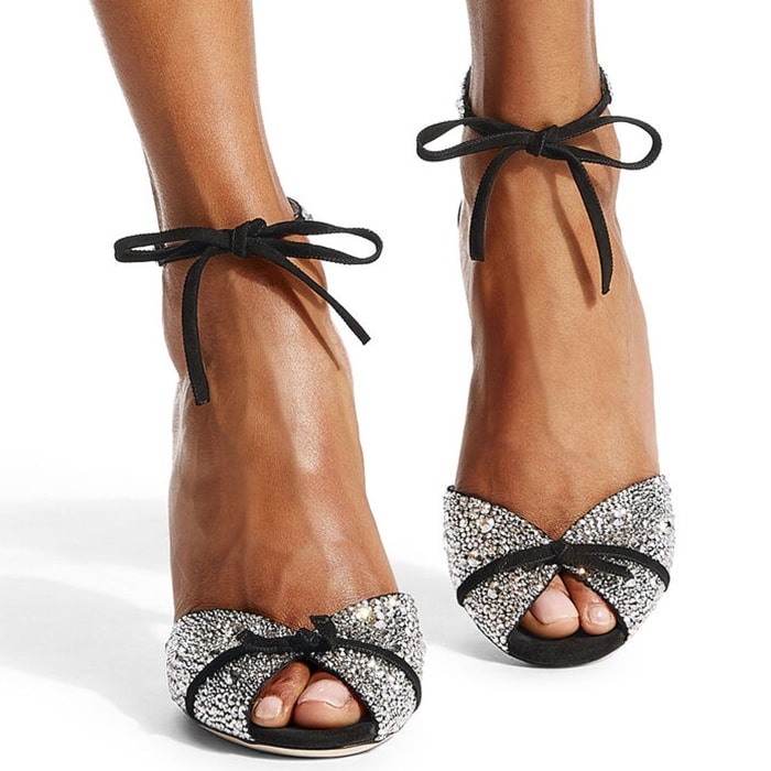 Dazzling jewelled embellishment and delicate velvet bows add red-carpet glamour to these peep-toe leather sandals