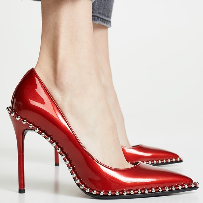 Silvery ball studs—an edgy detail seen in Alexander Wang's ready-to-wear collections—highlight the sharply pointed toe of this ultra-versatile stiletto