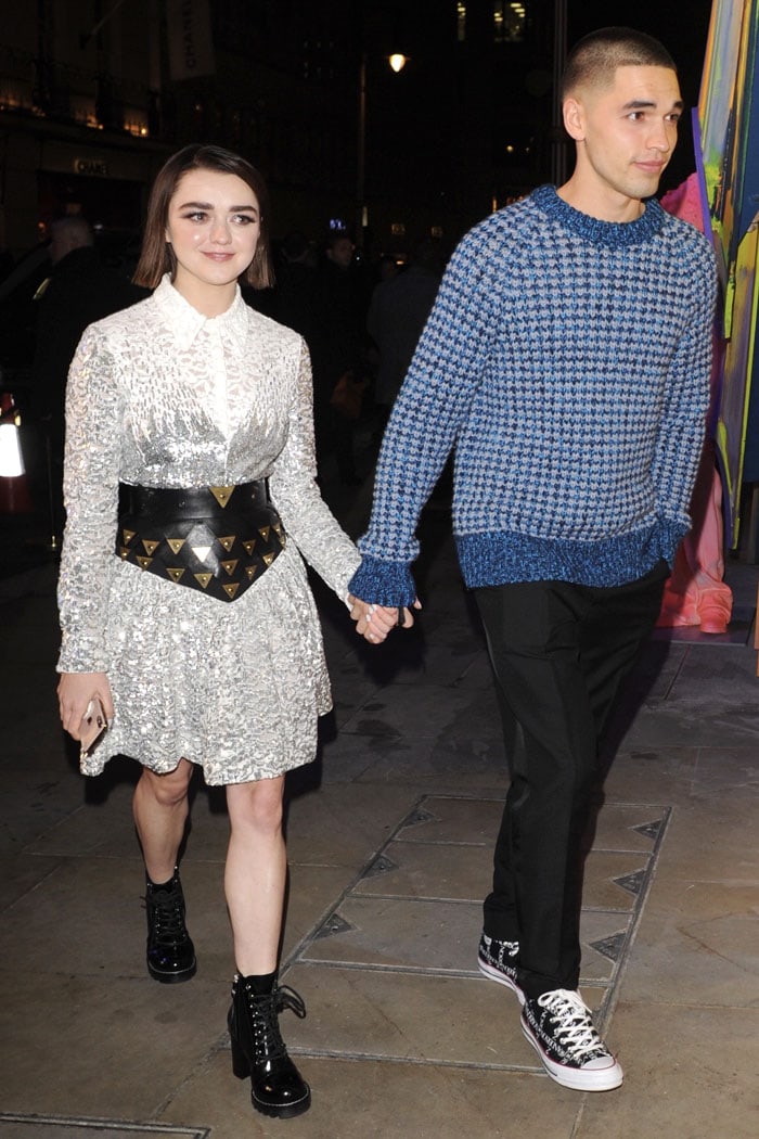 Maisie Williams holding hands with then-boyfriend Reuben Selby at the reopening of the Louis Vuitton New Bond Street Maison store held at Annabel's in London