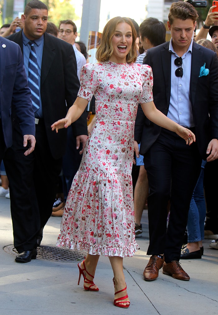 Natalie Portman brightened the New York streets in The Vampire's Wife's floral "The Hummingbird" dress, finishing the romantic look with vibrant red satin Dior sandals