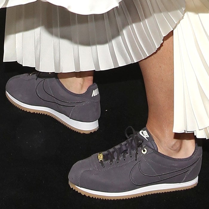 Maria Sharapova completes her look with her own Nike LA Cortez x Maria Sharapova sneakers in muted gray suede with gum soles