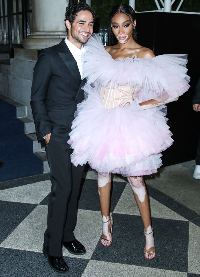 Zac Posen and Winnie Harlow arrive at the 2019 Harper's BAZAAR Celebration of 'ICONS By Carine Roitfeld'
