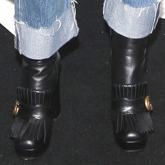 Closeup of Zosia Mamet's Gucci Marmont kiltie platform boots