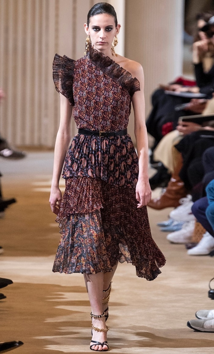 On the runway, Altuzarra’s Fall 2019 Kamala dress reveals its full construction—tiered accordion pleats, ruffled trims, and a cinched waist—designed to create motion while maintaining structure