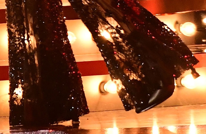 Carrie Underwood completes the rock-chic vibe of her performance look with pointed-toe boots