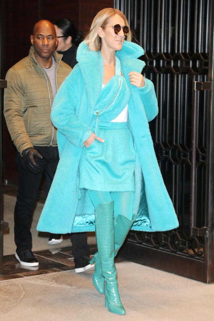 Celine Dion wears turquoise Max Mara Beboot thigh-high boots with a matching coat and mini skirt in New York City