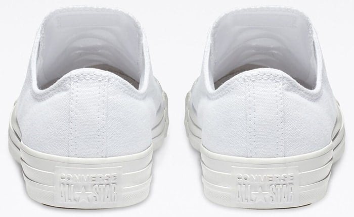 White monochrome Converse Chuck Taylor All Star low-top featuring a tonal 3D heel patch and matching white midsole