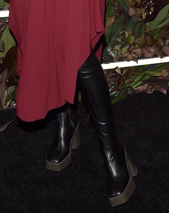 Her chunky over-the-knee Stella McCartney boots grounded the look with height and edge, completing the runway-inspired statement