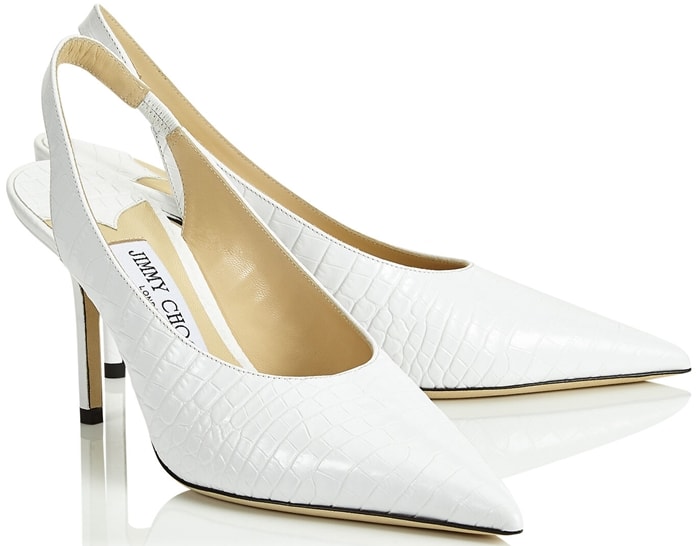 The pointed-toe Jimmy Choo slingback pumps in latte croc-embossed leather add a refined, architectural finish to her daytime street-style look