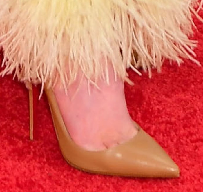 Kacey Musgraves grounds her statement Valentino dress with nude leather Christian Louboutin So Kate pumps, a timeless pointed-toe silhouette celebrated for its sleek, leg-lengthening profile