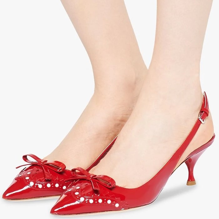 Miu Miu has been synonymous with luxury and forward-thinking design, and has a creative and innovative take on femininity, as seen in these vibrant red patent leather brogue detail slingback pumps