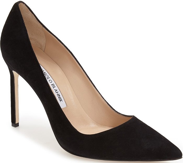 The Manolo Blahnik “BB” pump in black suede is the designer’s iconic court shoe, celebrated for its perfectly balanced pointed toe and timeless stiletto silhouette