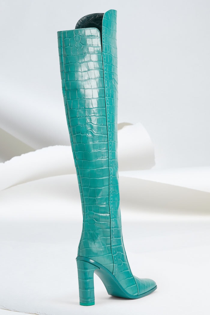 Side and back view of Max Mara turquoise croc-embossed Beboot thigh-high boots