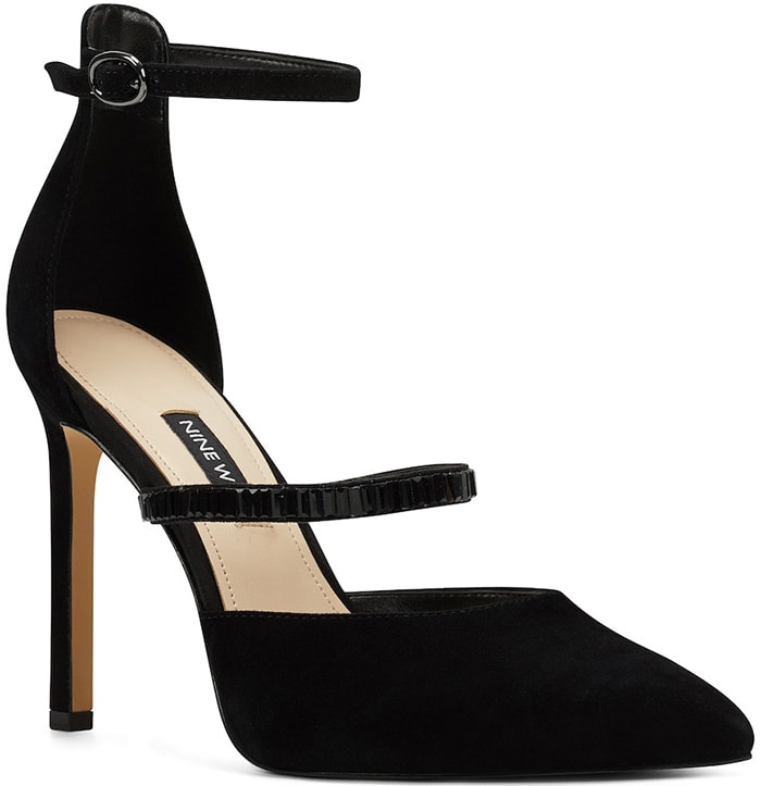 Nine West’s black “Thalita” pumps feature a pointed-toe silhouette, slim ankle strap, and high stiletto heel for a polished, modern finish