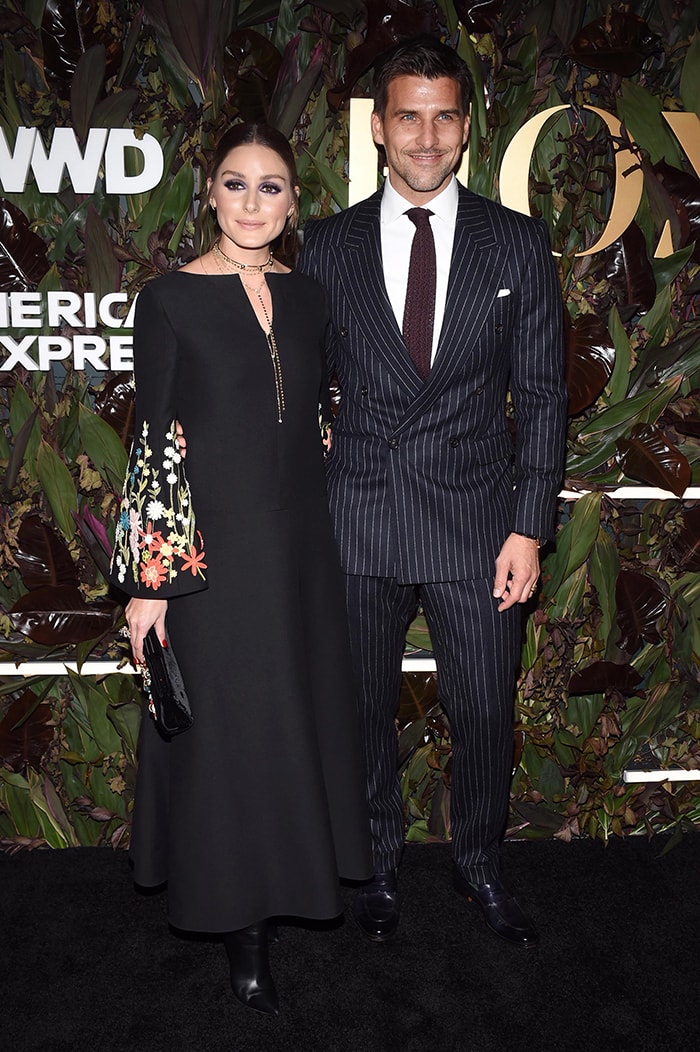 The fashion influencer was joined by husband Johannes Huebl, who complemented her statement Valentino look in a sharp pinstripe suit