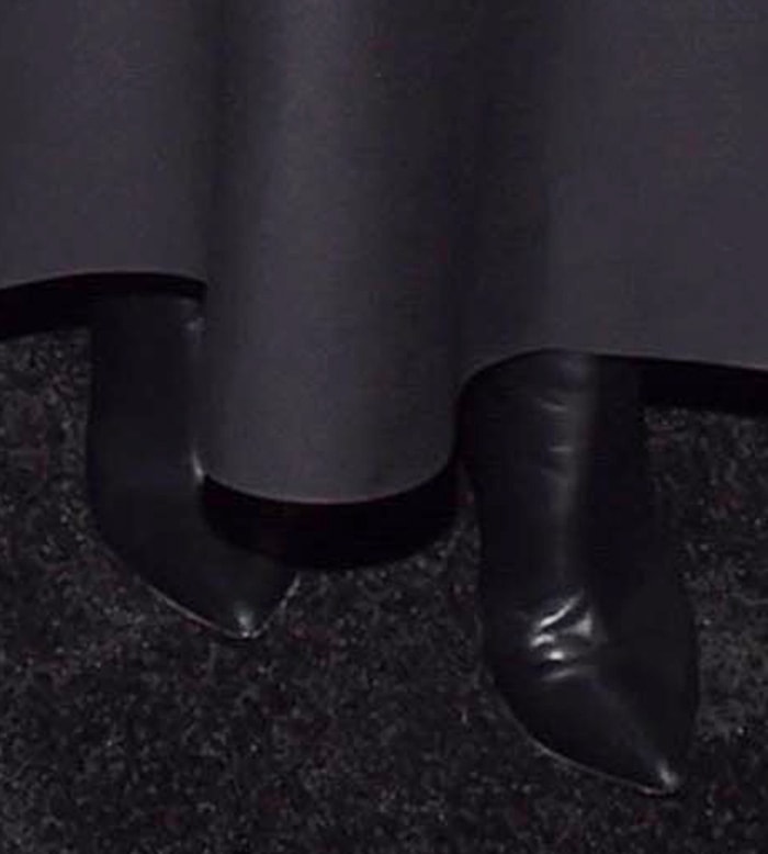 Her choice of sleek black pointed-toe boots lent the romantic Valentino gown a modern, gothic edge