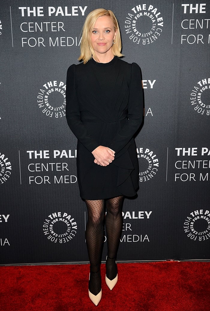 Reese Witherspoon arrives at The Morning Show Paley Center premiere in a sleek long-sleeve LBD that highlights her petite frame against the red carpet backdrop