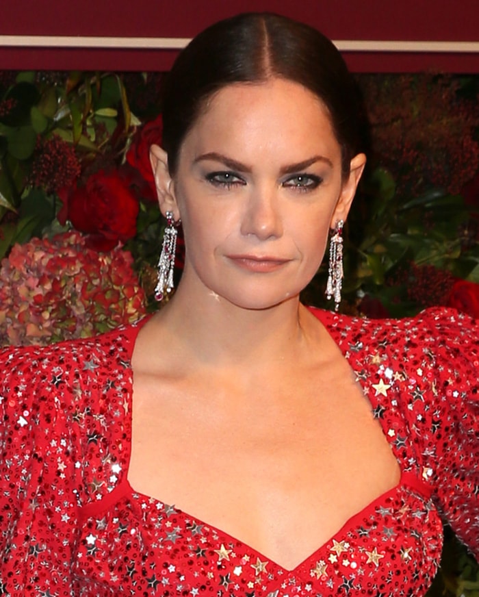 Ruth Wilson wears her hair in a polished updo to highlight her dramatic eyeliner and Bulgari diamond earrings