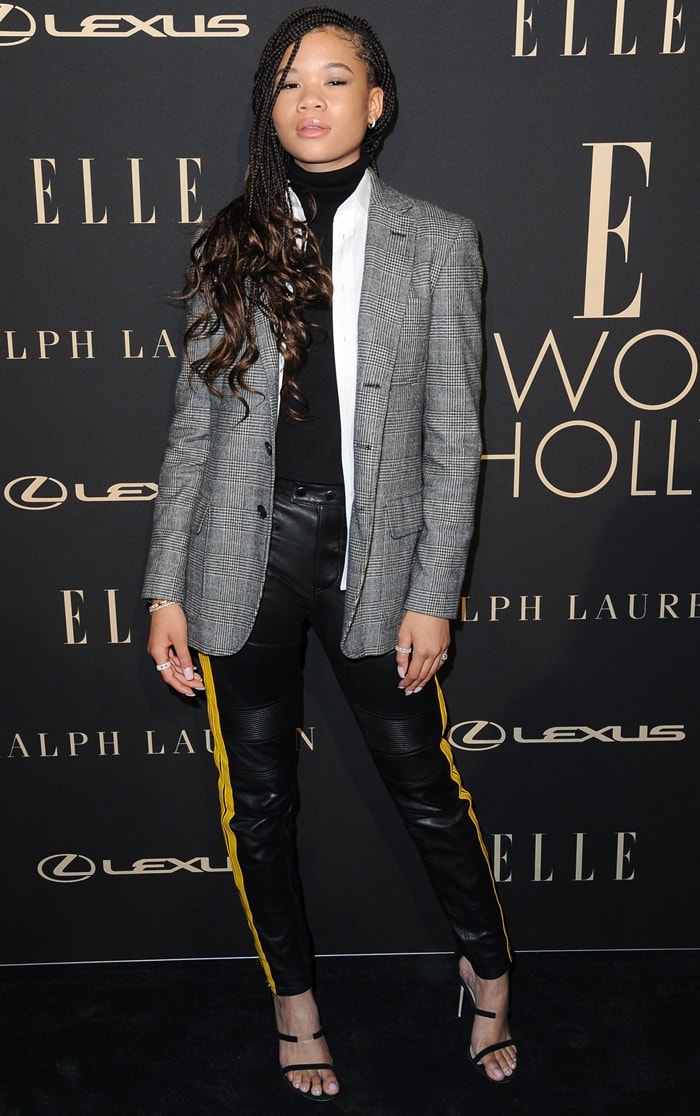 Storm Reid traded sculptural couture for tailored Polo Ralph Lauren separates at the 2019 ELLE Women in Hollywood Celebration, pairing a checked blazer and leather trousers with minimalist Tamara Mellon sandals for a sleek, menswear-inspired finish