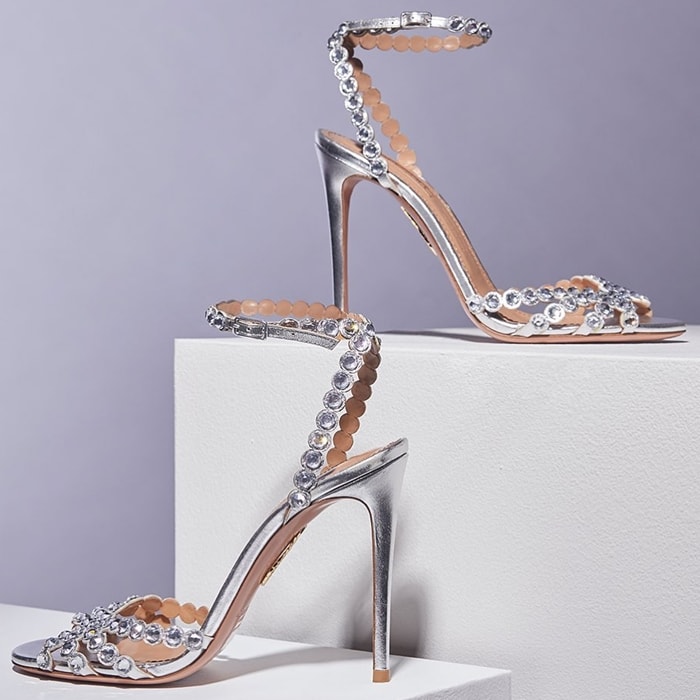 These sandals have been made in Italy from silver leather and dusted with faceted crystals that shimmer under even the dimmest light