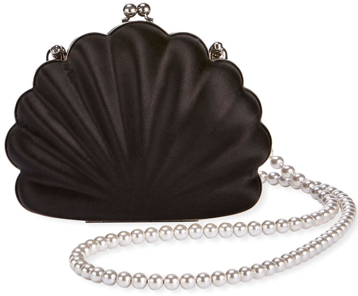 Balenciaga's satin Beads Shell clutch paired sculptural scalloped curves with a pearl-beaded strap, lending a whimsical, romantic counterpoint to Emma Watson's darkly gothic evening ensemble