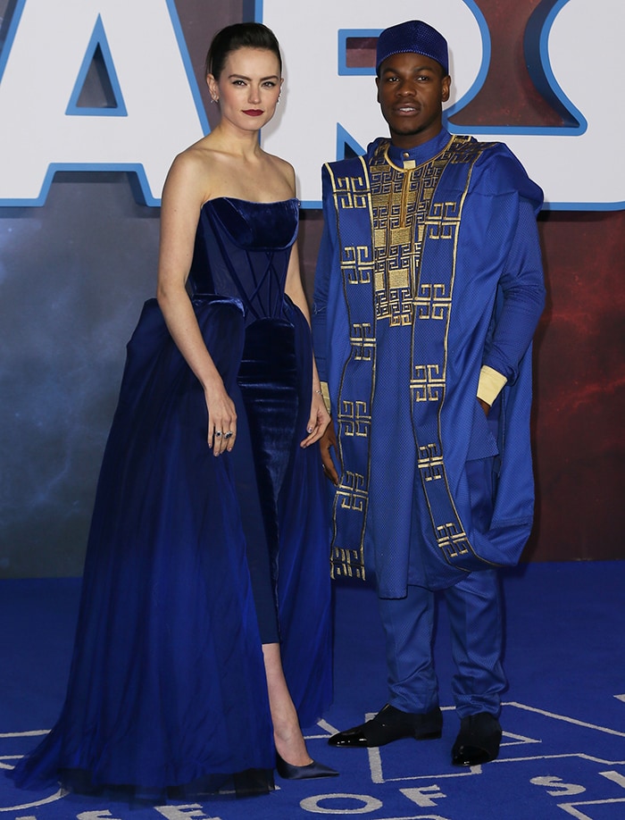 Daisy Ridley and John Boyega coordinate in striking blue looks while posing together at the Star Wars: The Rise of Skywalker European premiere in London