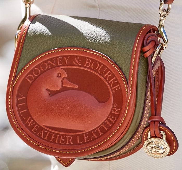 Dooney Bourke handbags are finished with neat topstitching and polished gold hardware