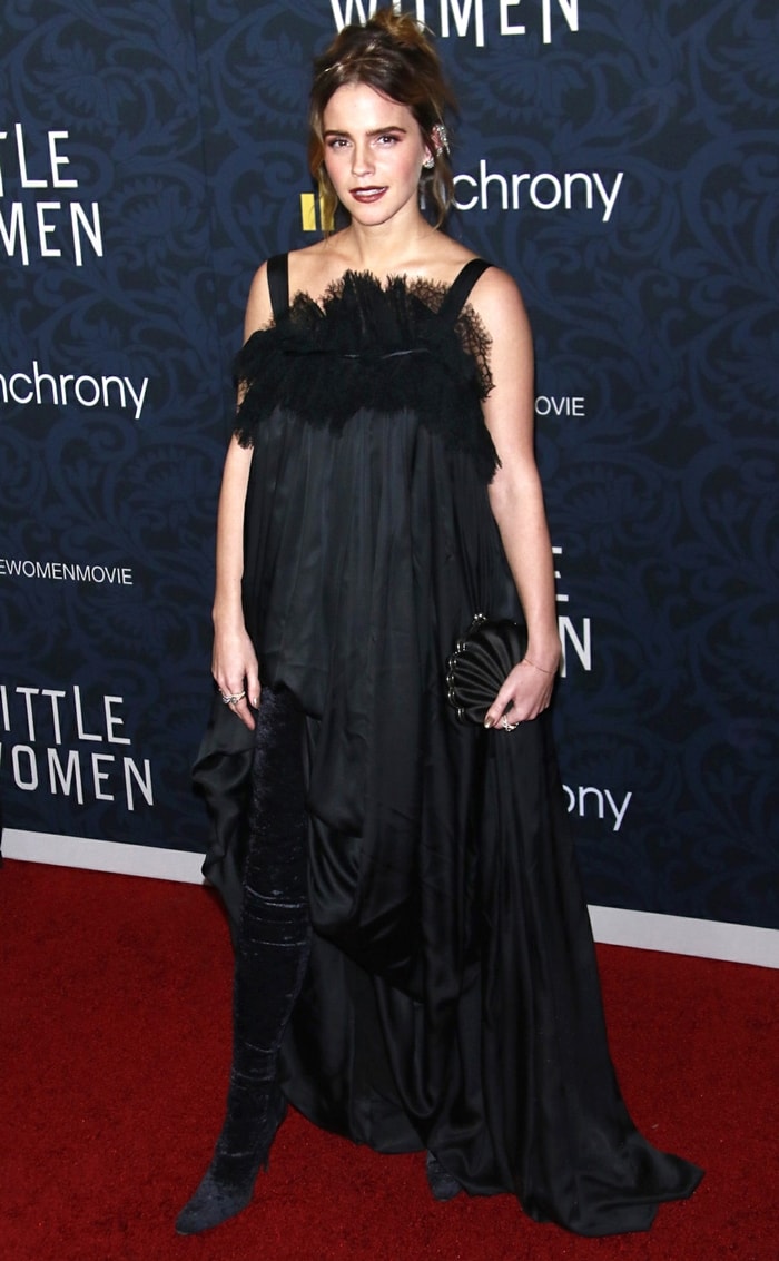 Emma Watson redefined red-carpet boot styling by tucking the hem of her Balenciaga Spring 2020 gown into a thigh-high velvet boot, transforming an archival runway look into one of the most debated fashion moments of 2019