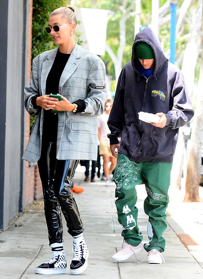 Justin Bieber wears pink Vans Authentic sneakers, while Hailey Baldwin opts for Vans Sk8-Hi Check shoes while leaving a spa in Beverly Hills on May 16, 2019