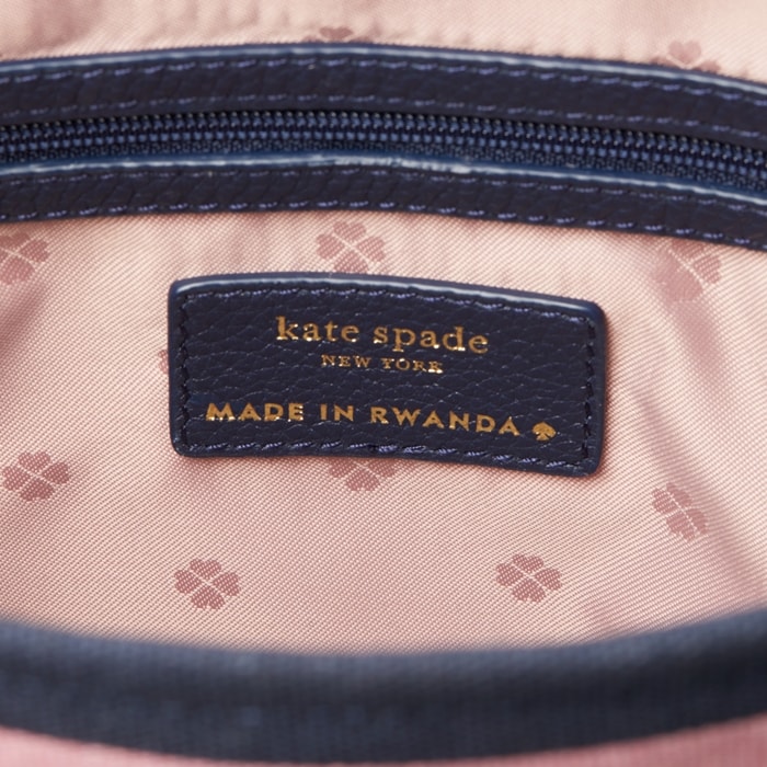 Authentic Kate Spade New York label on a limited-edition handbag handcrafted by local artisans in Masoro, Rwanda — part of the brand’s global initiative supporting women-led craftsmanship
