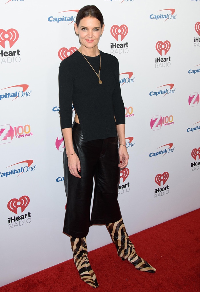 The sharp lines of Katie Holmes’ black rib-knit top contrasted with the relaxed shape of her zebra-print calf hair boots, creating a clean head-to-toe silhouette on the Jingle Ball red carpet