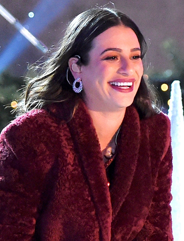Lea Michele all smiles while performing at the Rockefeller Center Christmas Tree Lighting event