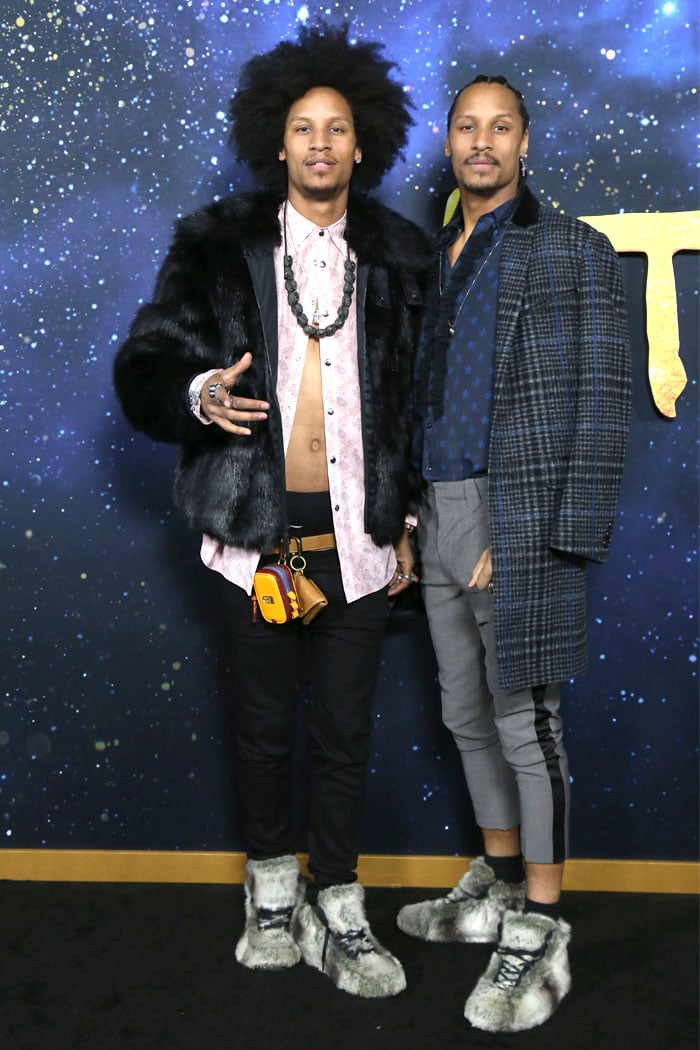 Dancers Larry Nicolas and Laurent Bourgeois, aka Les Twins, brought feline flair to the Cats world premiere at Alice Tully Hall, NYC, on December 16, 2019, with fur-trimmed jackets, bold accessories, and matching gray fur-covered sneakers