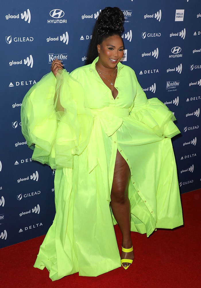 Lizzo wears a neon green Christopher John Rogers gown with matching pointed-toe heels at the 30th Annual GLAAD Media Awards