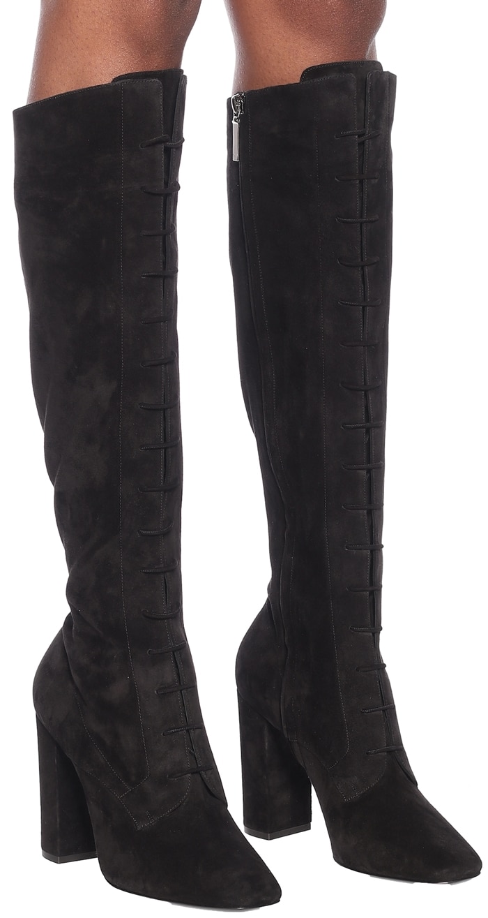 Sensual and striking, the black suede Laura boots from Saint Laurent tap into the label's confident styling