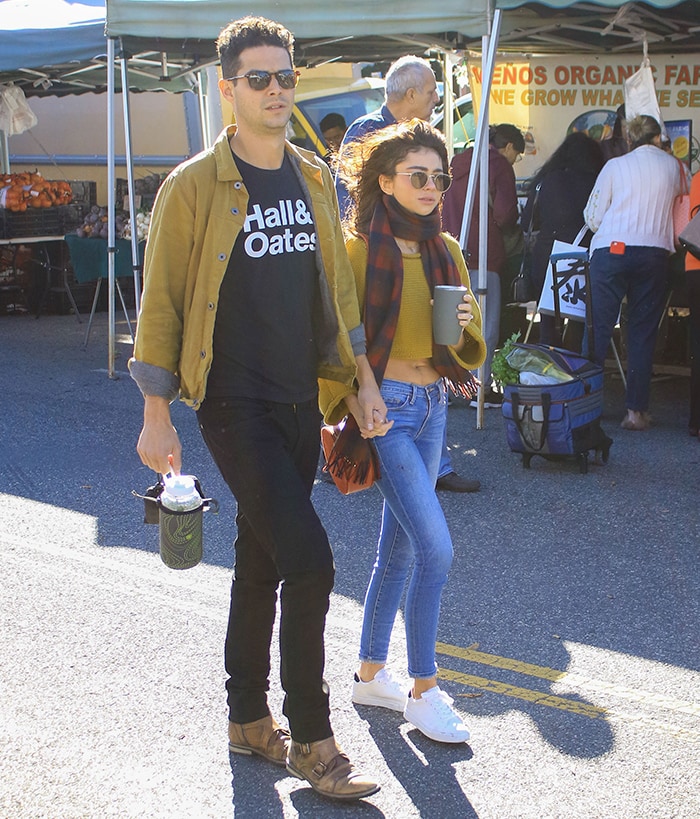 Sarah Hyland and Wells Adams wearing coordinated mustard yellow outfits at a Los Angeles farmers market