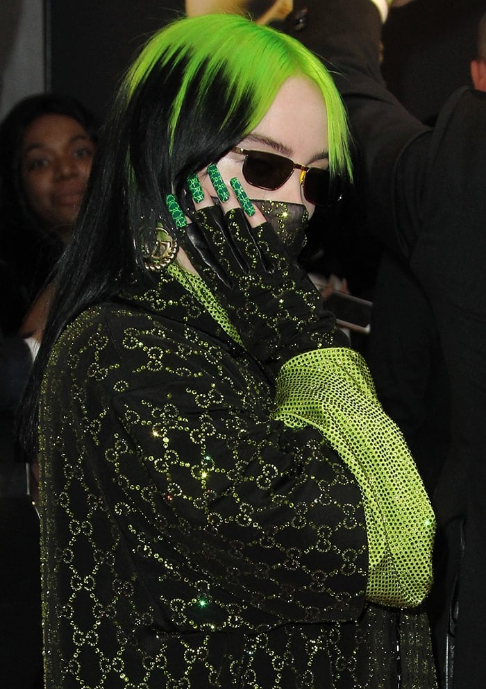 Billie Eilish elevates her head-to-toe Gucci moment with neon green monogram nails, perfectly mirroring the crystal-studded logo print of her oversized co-ord at the 2020 Grammy Awards—a detail-driven finish that ties her entire look together