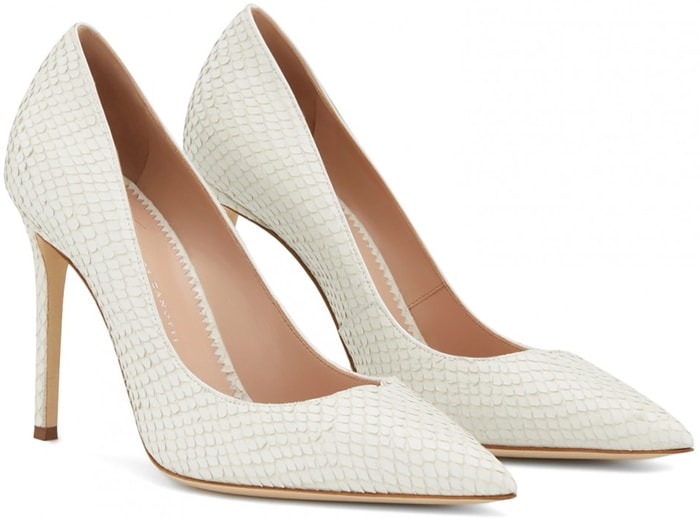 Rendered in white reptile-embossed leather, the Giuseppe Zanotti “Carolyne” pumps combine a classic pointed toe with a slender stiletto for a clean, architectural finish