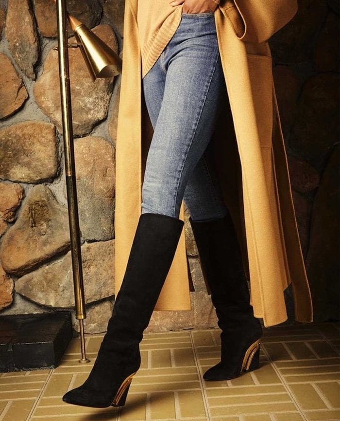 Christian Louboutin’s Levitibotta knee-high boots use a transparent center section and metallic framing to create the illusion of a floating heel