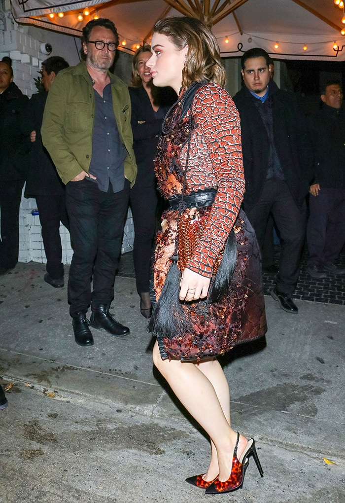 Joey King stuns in a Mary Katrantzou ombré mini dress with intricate beadwork and leather ruffle trims, paired with Alevi Milano tortoiseshell slingback pumps, as she steps out for W Magazine’s Best Performances party at Chateau Marmont