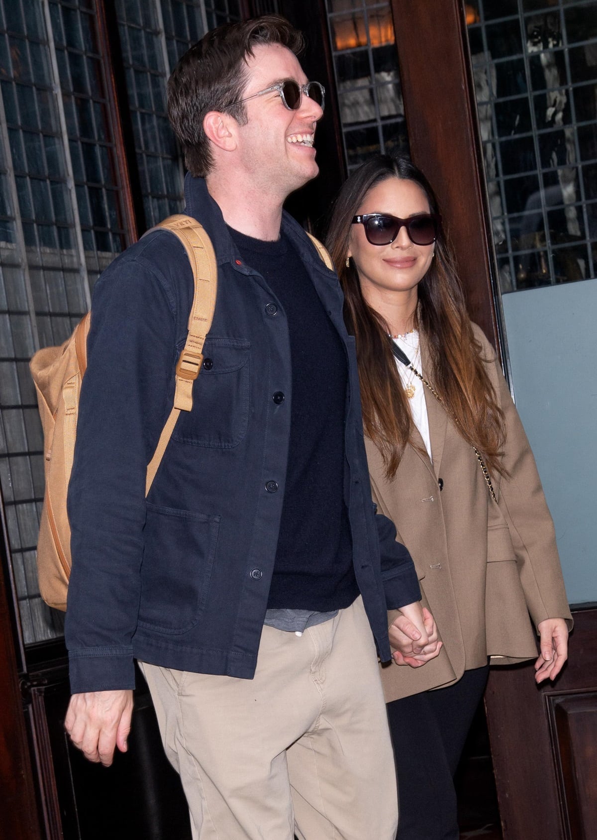 Olivia Munn and John Mulaney stepped out hand in hand in New York, keeping their couple style polished with tailored layers and classic sunglasses